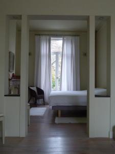 Uma cama ou camas num quarto em B&B Sparrow's Nest