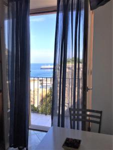 a dining room with a view of the ocean at Casa Mafalda B&B in Lipari