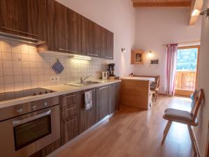 a kitchen with a sink and a counter top at Huberhof Mareit - Südtirol in Racines