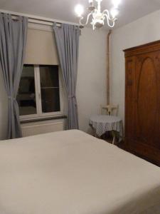 Uma cama ou camas num quarto em B&B Sparrow's Nest