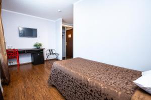 TV a/nebo společenská místnost v ubytování Primo Hotel