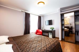 Postel nebo postele na pokoji v ubytování Primo Hotel