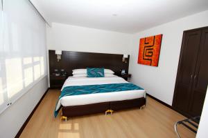 Postelja oz. postelje v sobi nastanitve Hotel Dann Cali