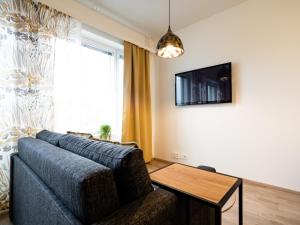 TV a/nebo společenská místnost v ubytování First Aparthotel Comet