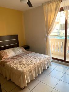 Ένα ή περισσότερα κρεβάτια σε δωμάτιο στο Hotel Posada San Juan