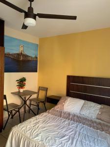Een bed of bedden in een kamer bij Hotel Posada San Juan