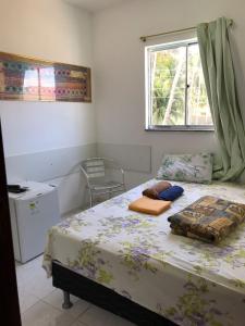 Un ou plusieurs lits dans un hébergement de l'établissement Pousada Tiriri Guesthouse
