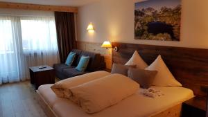 Rúm í herbergi á Hotel Garni Tirol