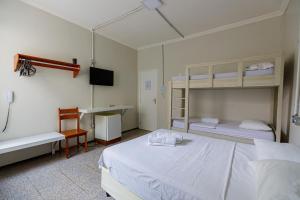 Postel nebo postele na pokoji v ubytování Hotel Meireles