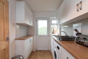 A cozinha ou cozinha compacta de Grampian Serviced Apartments - Park View