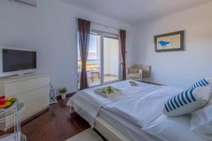 Postel nebo postele na pokoji v ubytování Villa Vrbnik