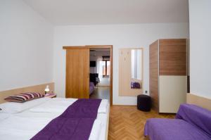 Posteľ alebo postele v izbe v ubytovaní Apartments Mirjana B