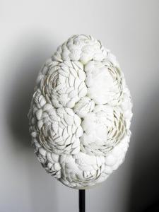 a white bowl with a spiral pattern on a stand at Boutique Hotel Placa in Krk