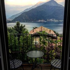 a view from a balcony with a table and chairs at Agriturismo Treterre in Pianello Del Lario