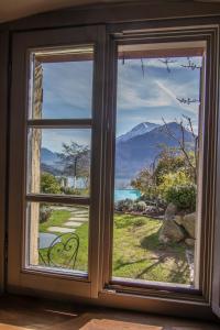 a window with a view of a mountain at Agriturismo Treterre in Pianello Del Lario