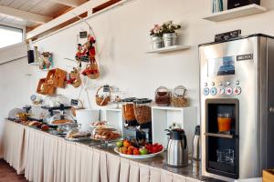 a kitchen with a counter with food on it at La Terrazza sul Centro in Palermo