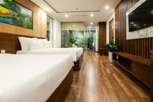 Ένα ή περισσότερα κρεβάτια σε δωμάτιο στο Nagila Boutique Hotel