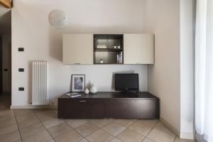 TV a/nebo společenská místnost v ubytování Residence La Vigna