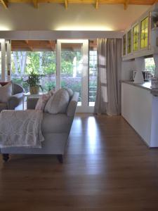 a living room with a couch and a kitchen at Retreat in Hillcrest