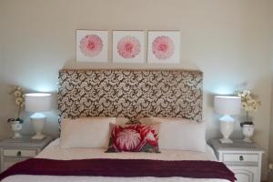 a bedroom with a bed with two night stands at Retreat in Hillcrest