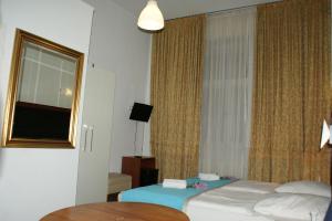 Postel nebo postele na pokoji v ubytování Hotel Garni Aaberna