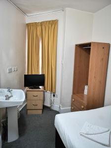 TV a/nebo společenská místnost v ubytování Aquarius Hotel