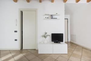 TV a/nebo společenská místnost v ubytování Residence La Vigna