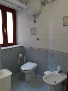 a bathroom with a toilet and a sink at RESIDENCE LE ROVINE in Ercolano +32 photos
