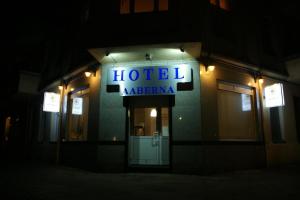 a building with a sign on the side of it at Hotel Garni Aaberna in Berlin