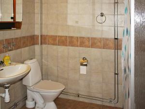 a bathroom with a toilet and a sink and a shower at 4 person holiday home in Tvååker-By Traum in Tvååker