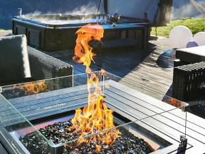 a fire pit with flames coming out of it at 8 person holiday home in Valldal in Valldal