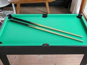 a pool table with chopsticks on top of it at 8 person holiday home in Harbo re in Harboør