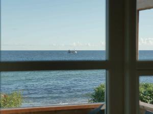 a view of the ocean from a window at 6 person holiday home in Allinge in Allinge