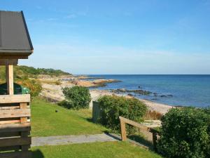 a view of the ocean from a house at 6 person holiday home in Allinge in Allinge