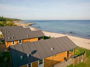 an aerial view of a house and the beach at 6 person holiday home in Allinge in Allinge