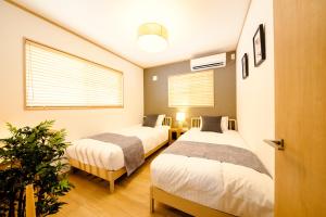 Una cama o camas en una habitación de FUJI-AKATSUKI Enn