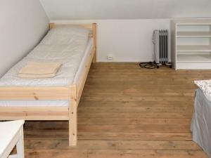 a bedroom with a bunk bed and a wooden floor at Holiday home Masfjordnes in Masfjorden