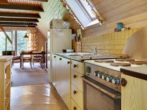 A kitchen or kitchenette at Holiday home Aakirkeby V