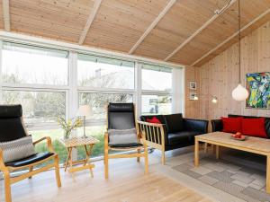 a living room with two chairs and a couch at 7 person holiday home in Thisted in Nørre Vorupør