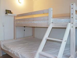 a couple of bunk beds in a room at Holiday Home Brøndbækken II in Nørre Hurup