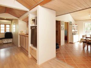 a room with a kitchen and a living room at 9 person holiday home in J gerspris in Jægerspris