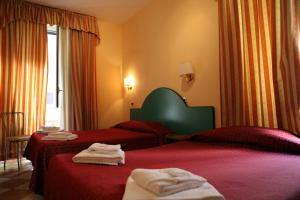 Postel nebo postele na pokoji v ubytování Hotel Hollywood