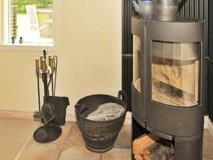 a kitchen with a coffee maker and a basket at 8 person holiday home in Oksb l in Øster Vrøgum