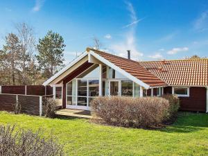 a house with a large window and a roof at Three-Bedroom Holiday home in Nykøbing Sj 7 in Lumsås