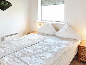 Postel nebo postele na pokoji v ubytování Holiday Home Helmklit II