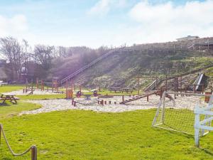 a park with a roller coaster on a hill at 7 person holiday home in Lemvig-By Traum in Lemvig