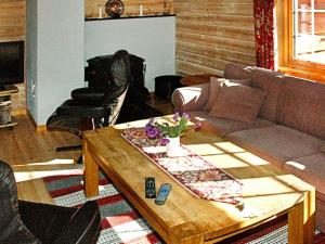 a living room with a couch and a coffee table at Four-Bedroom Holiday home in Olden 2 in Olden