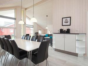 a dining room with a table and chairs at 10 person holiday home in Gro enbrode in Großenbrode