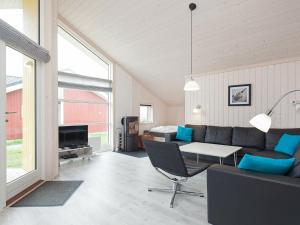 a living room with a couch and a table at 10 person holiday home in Gro enbrode in Großenbrode