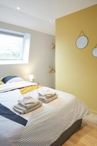 En eller flere senge i et værelse på LocationsTourcoing - Le Famelart